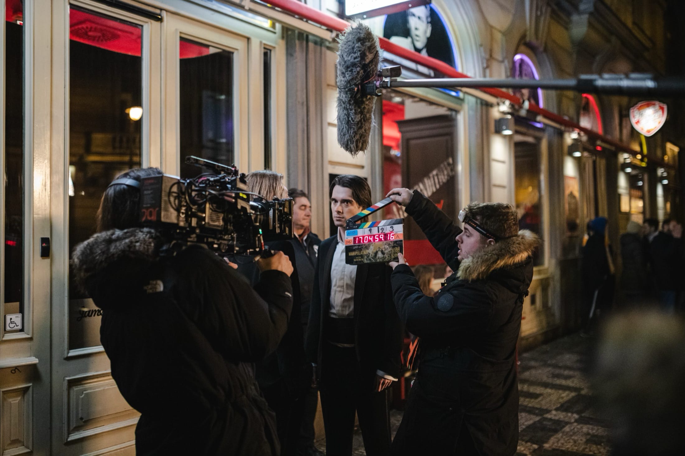 Vojtěch Babišta on the night set of Manipulation, camera crew around him