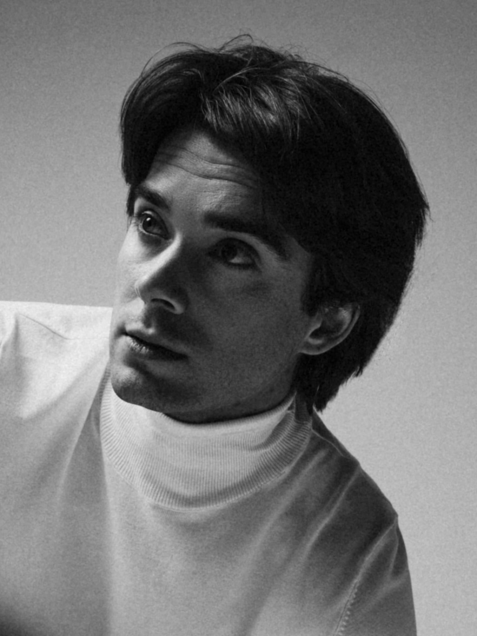 Black and white portrait in a white turtleneck